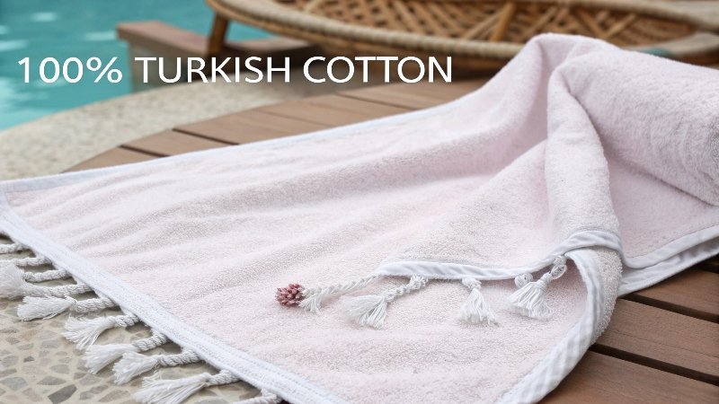 inspecting the tassels and edge of a Turkish towel