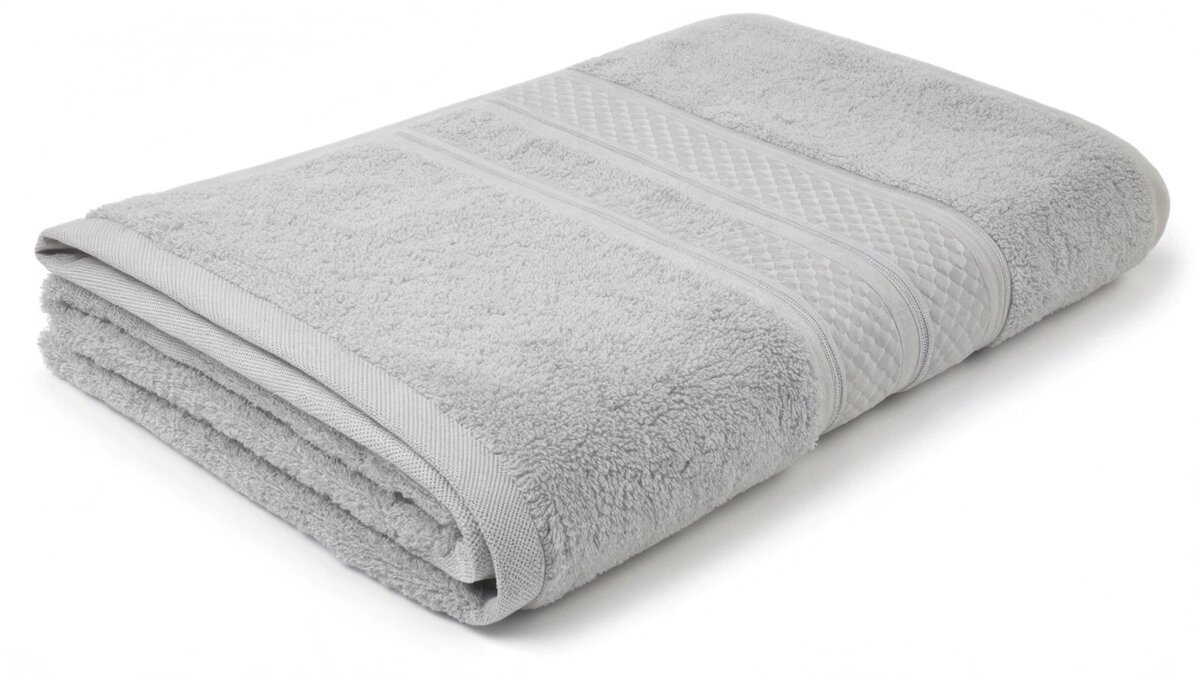 a stack of white towels on a scale
